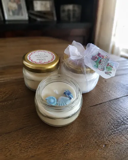 Candele profumate in barattolini di vetro